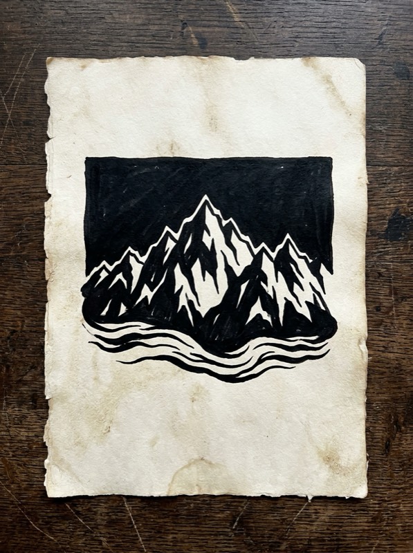 Blackwork mountain range sternum tattoo